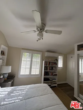 a bedroom with a bed and closet