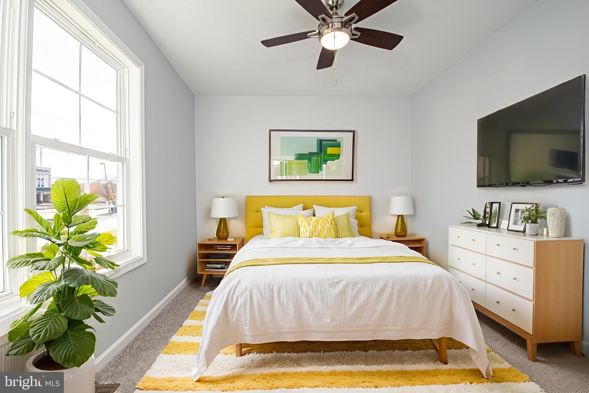 709 Ross Street Winchester, VA 22601 - Photo 40 of 40 a spacious bedroom with a bed and a flat screen tv