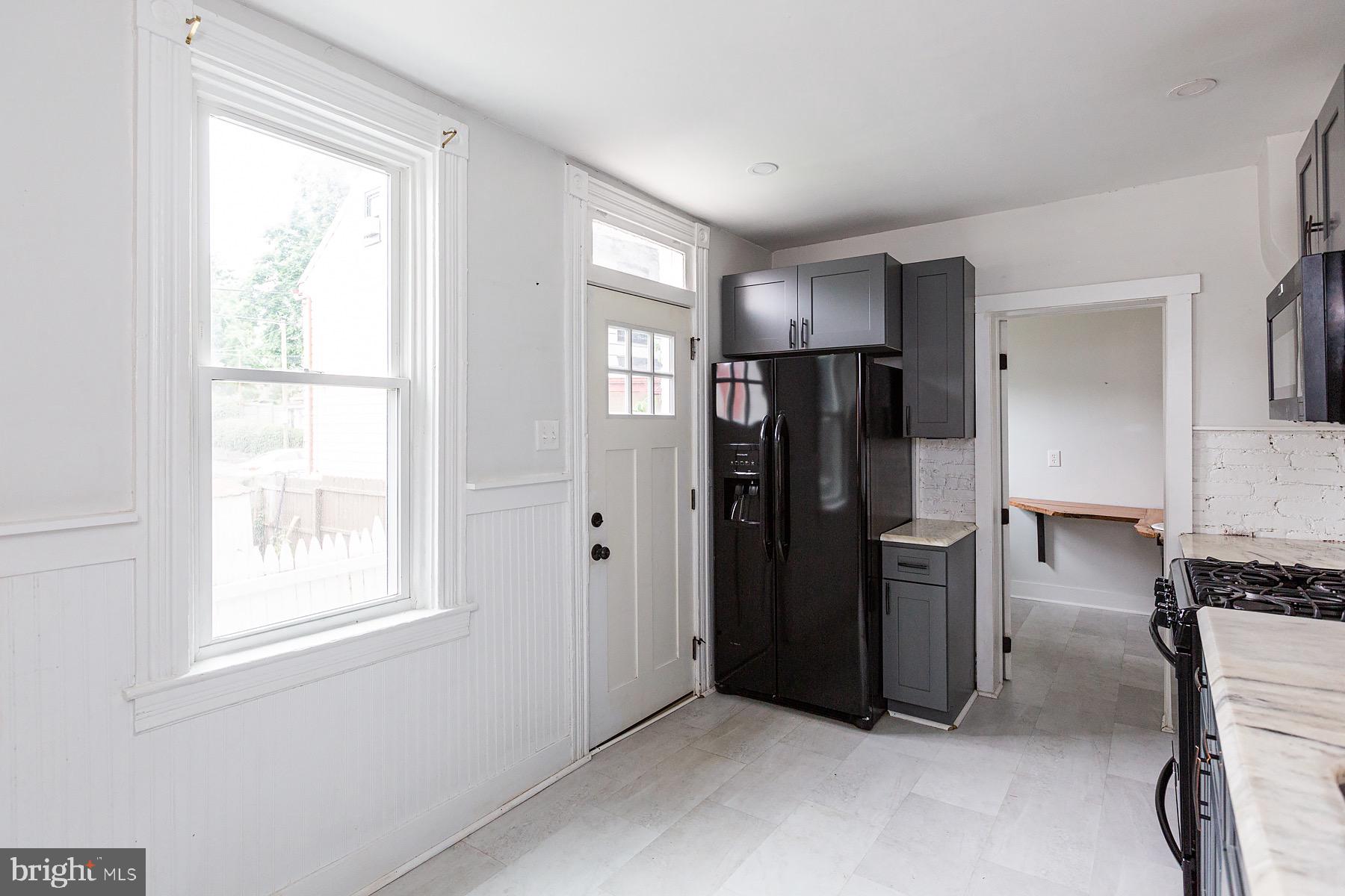 138 Laurel Street Lancaster, PA 17603 - Photo 16 of 42 a view of kitchen with refrigerator and window