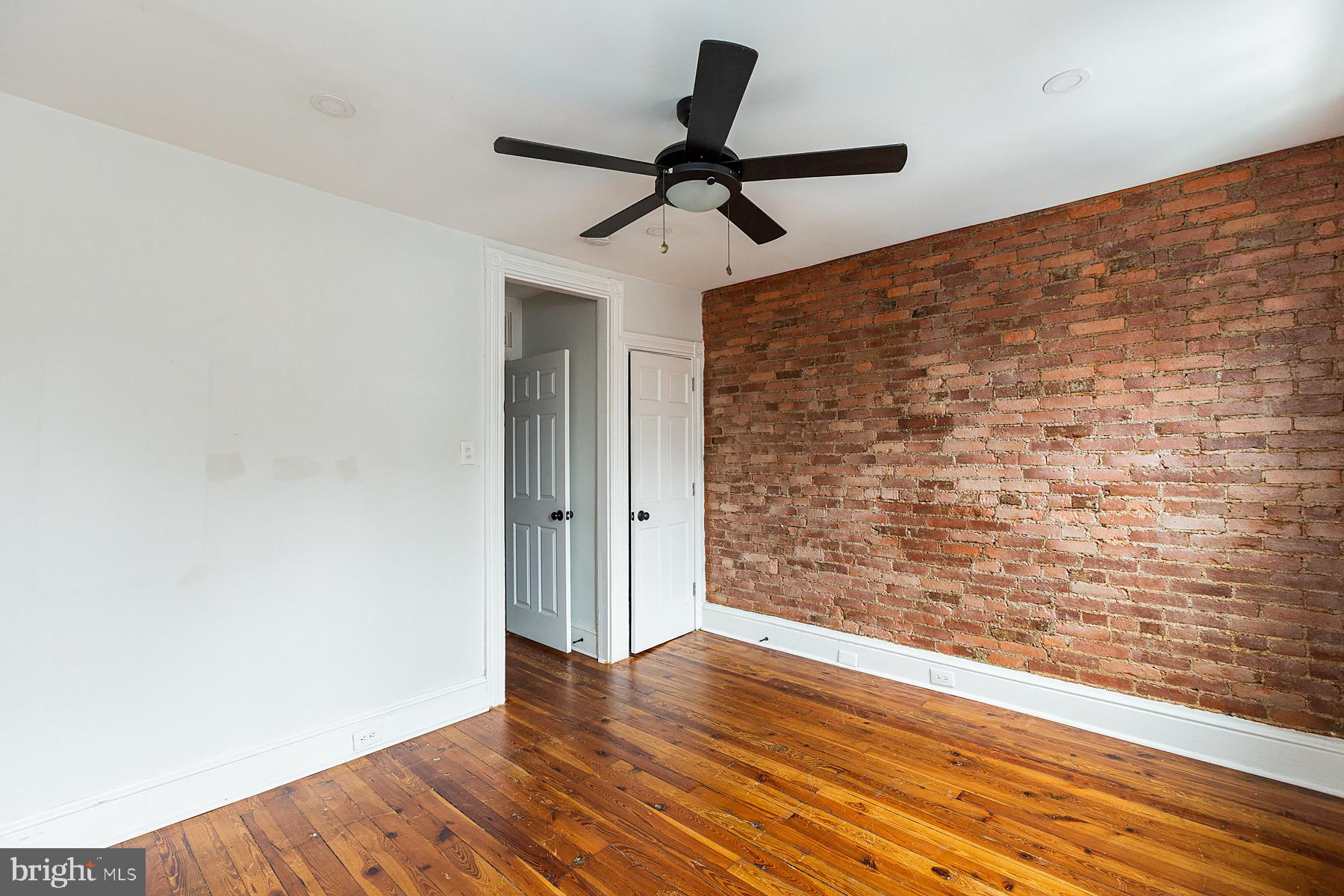 138 Laurel Street Lancaster, PA 17603 - Photo 25 of 42 a view of empty room with wooden floor