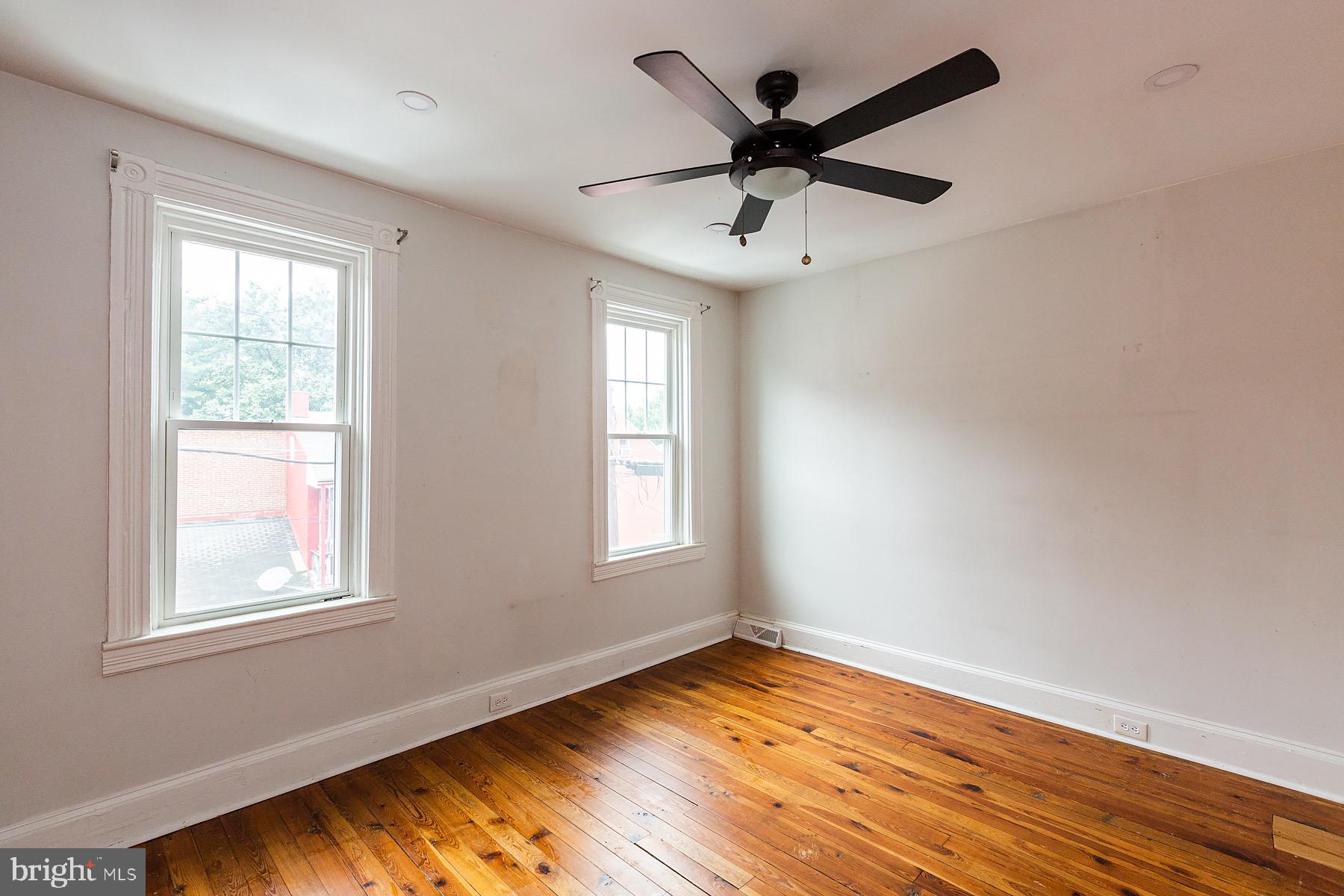 138 Laurel Street Lancaster, PA 17603 - Photo 29 of 42 a view of empty room with wooden floor and fan