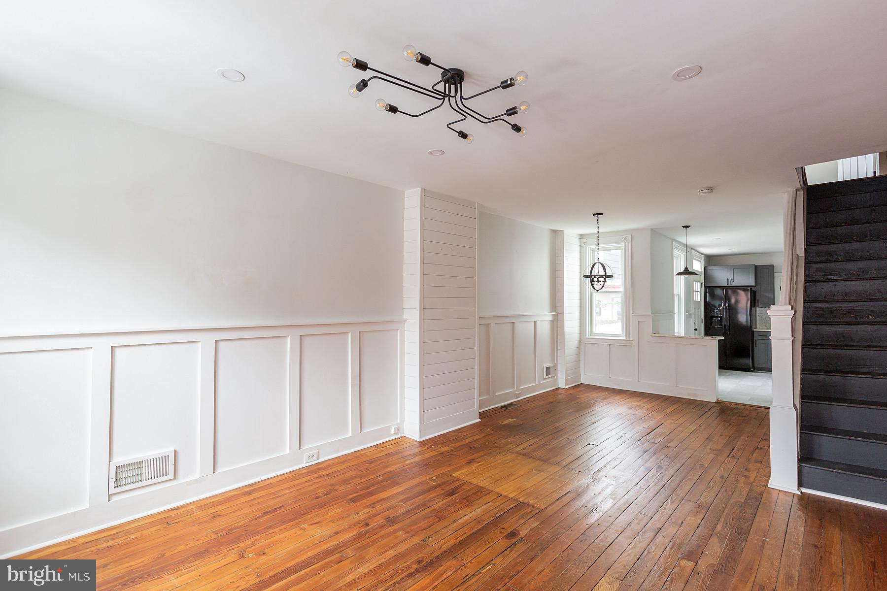 138 Laurel Street Lancaster, PA 17603 - Photo 3 of 42 a view of an empty room with wooden floor