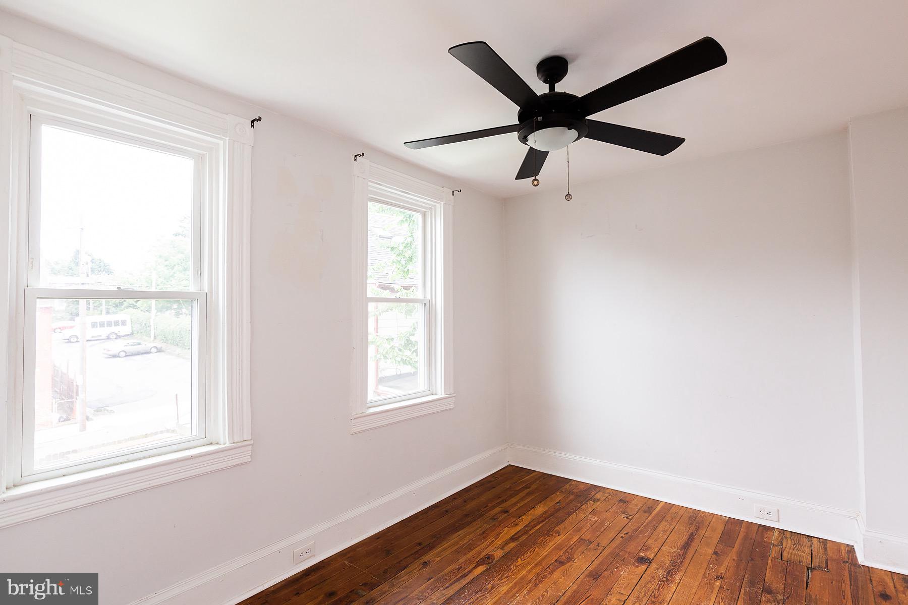 138 Laurel Street Lancaster, PA 17603 - Photo 38 of 42 a view of an empty room with wooden floor and a window