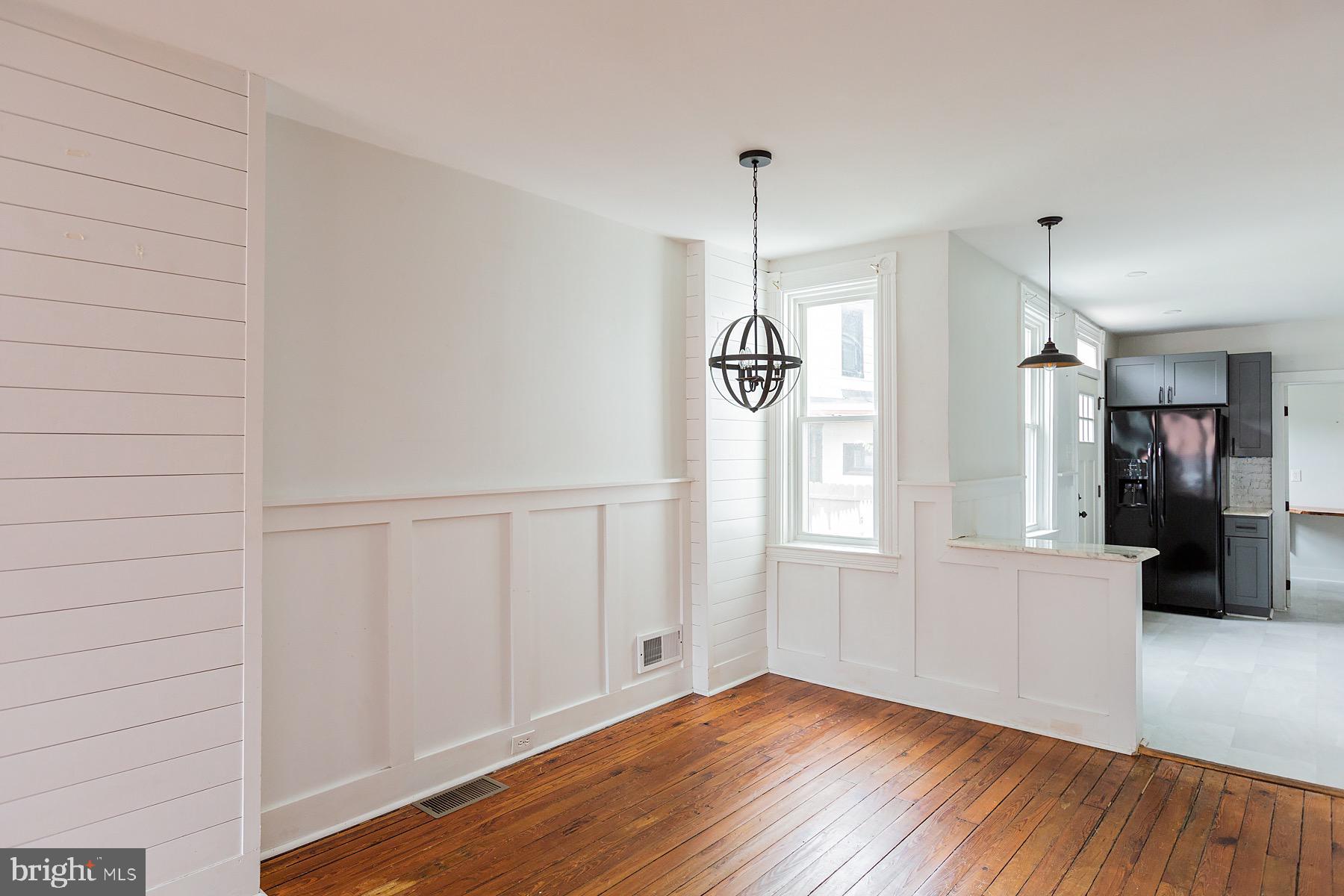 138 Laurel Street Lancaster, PA 17603 - Photo 9 of 42 a view of empty room with wooden floor and fan