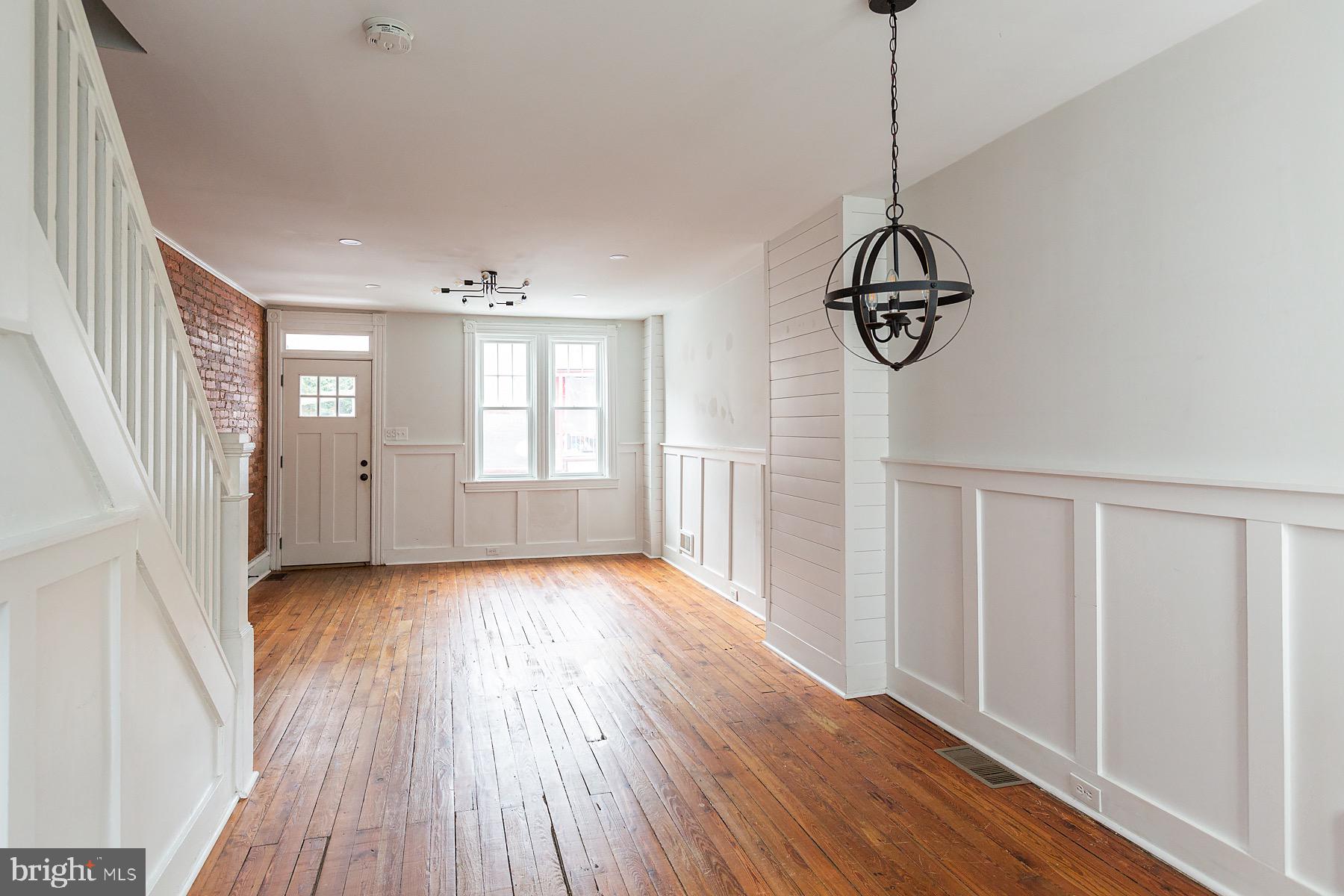 138 Laurel Street Lancaster, PA 17603 - Photo 10 of 42 a view of empty room with wooden floor and window