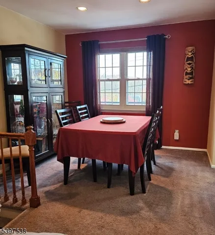 a dining room with a table and chairs