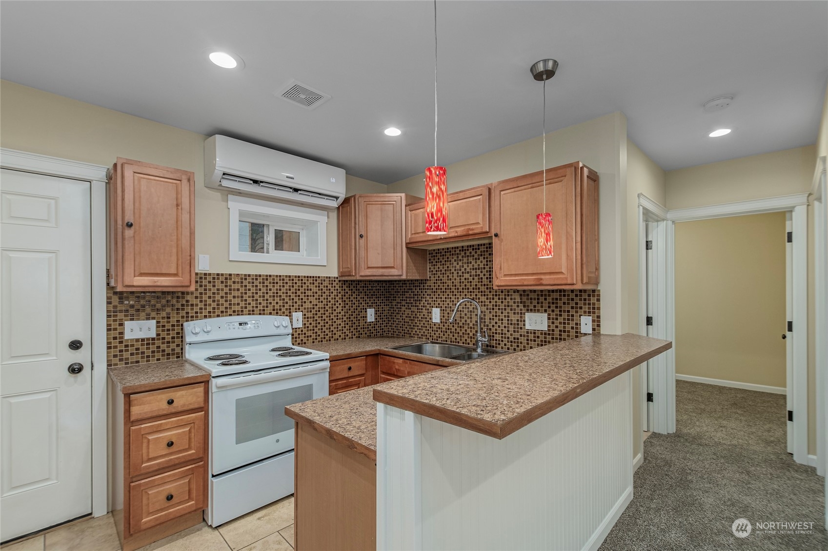 1201 Monitor Avenue Wenatchee, WA 98801 - Photo 14 of 24 a kitchen with a sink stove and cabinets