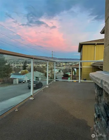 a view of a city street from a balcony