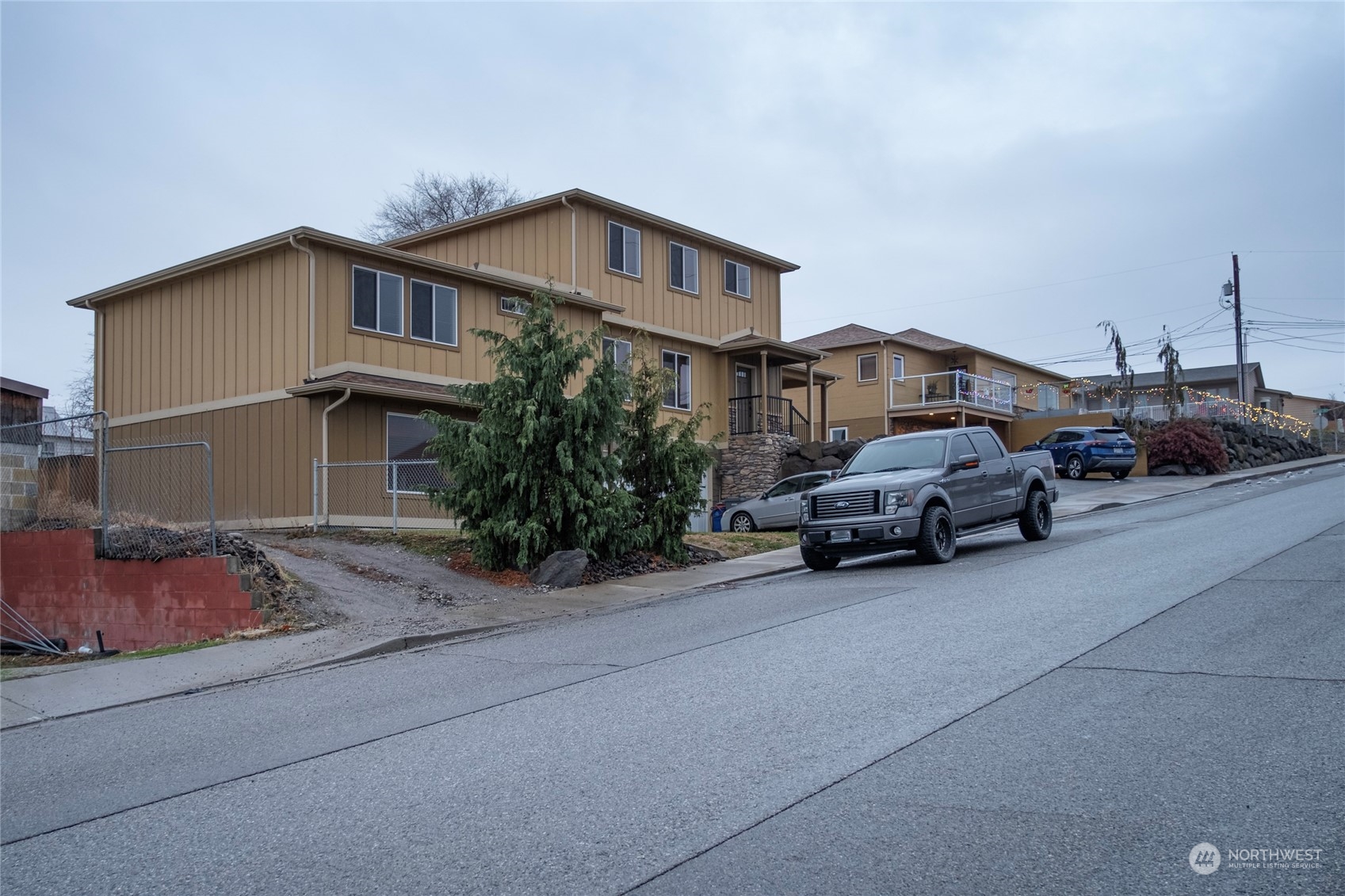 1201 Monitor Avenue Wenatchee, WA 98801 - Photo 3 of 24 a car parked in front of a house