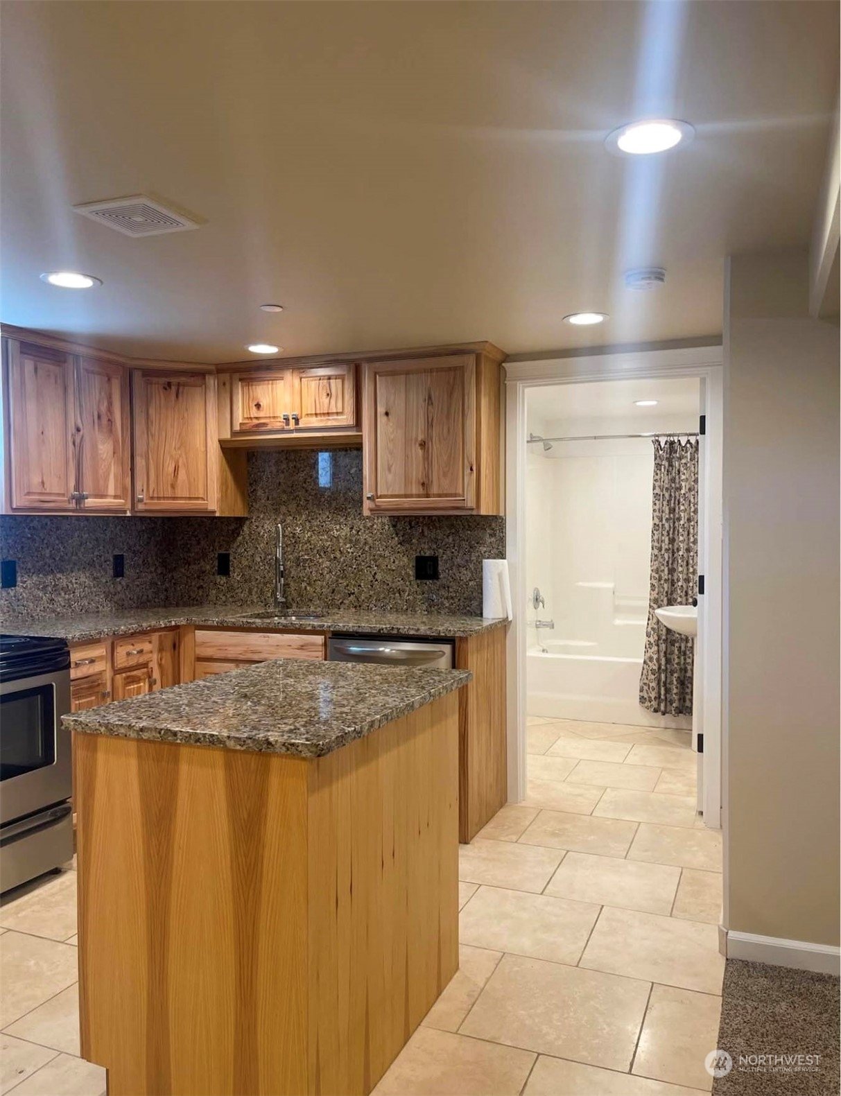 1201 Monitor Avenue Wenatchee, WA 98801 - Photo 8 of 24 a large kitchen with stainless steel appliances granite countertop a stove sink and cabinets