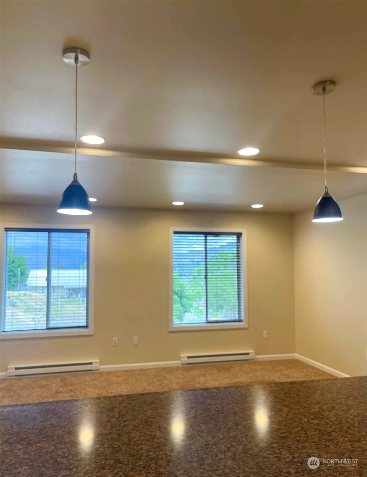 1201 Monitor Avenue Wenatchee, WA 98801 - Photo 9 of 24 a view of an empty room with wooden floor and a window