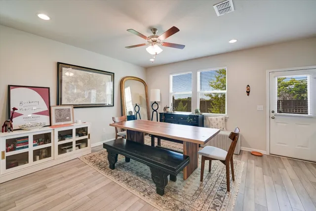 a living room with furniture a table and a large window