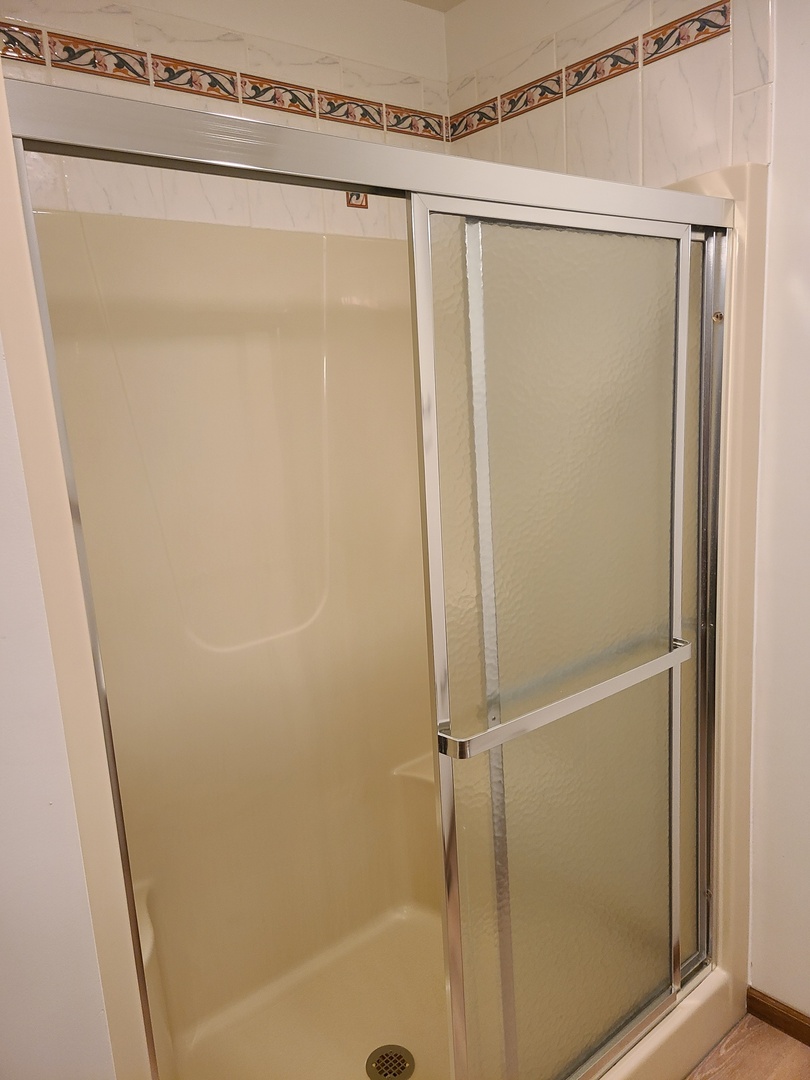 2871 East 777th Road Utica, IL 61373 - Photo 11 of 19 a bathroom with a glass shower door