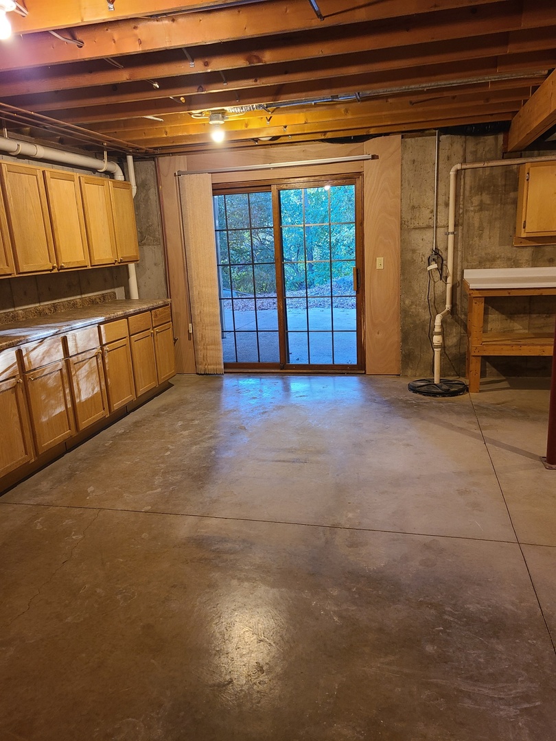 2871 East 777th Road Utica, IL 61373 - Photo 17 of 19 a view of an empty room with a fireplace
