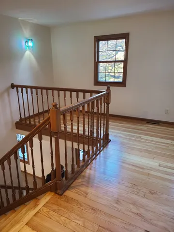 a view of entryway with wooden floor