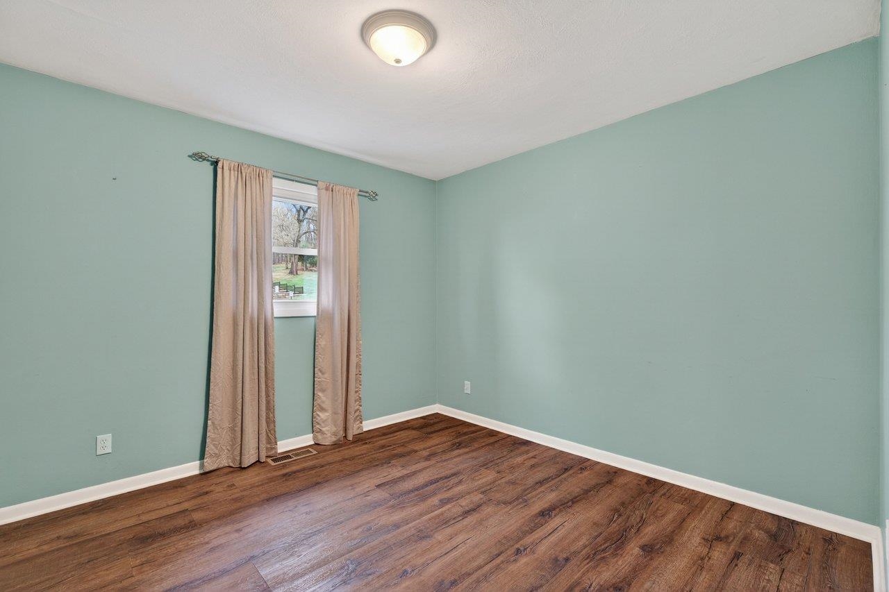 3259 Zion Church Road Broadway, VA 22815 - Photo 18 of 48 an empty room with wooden floor and entrance
