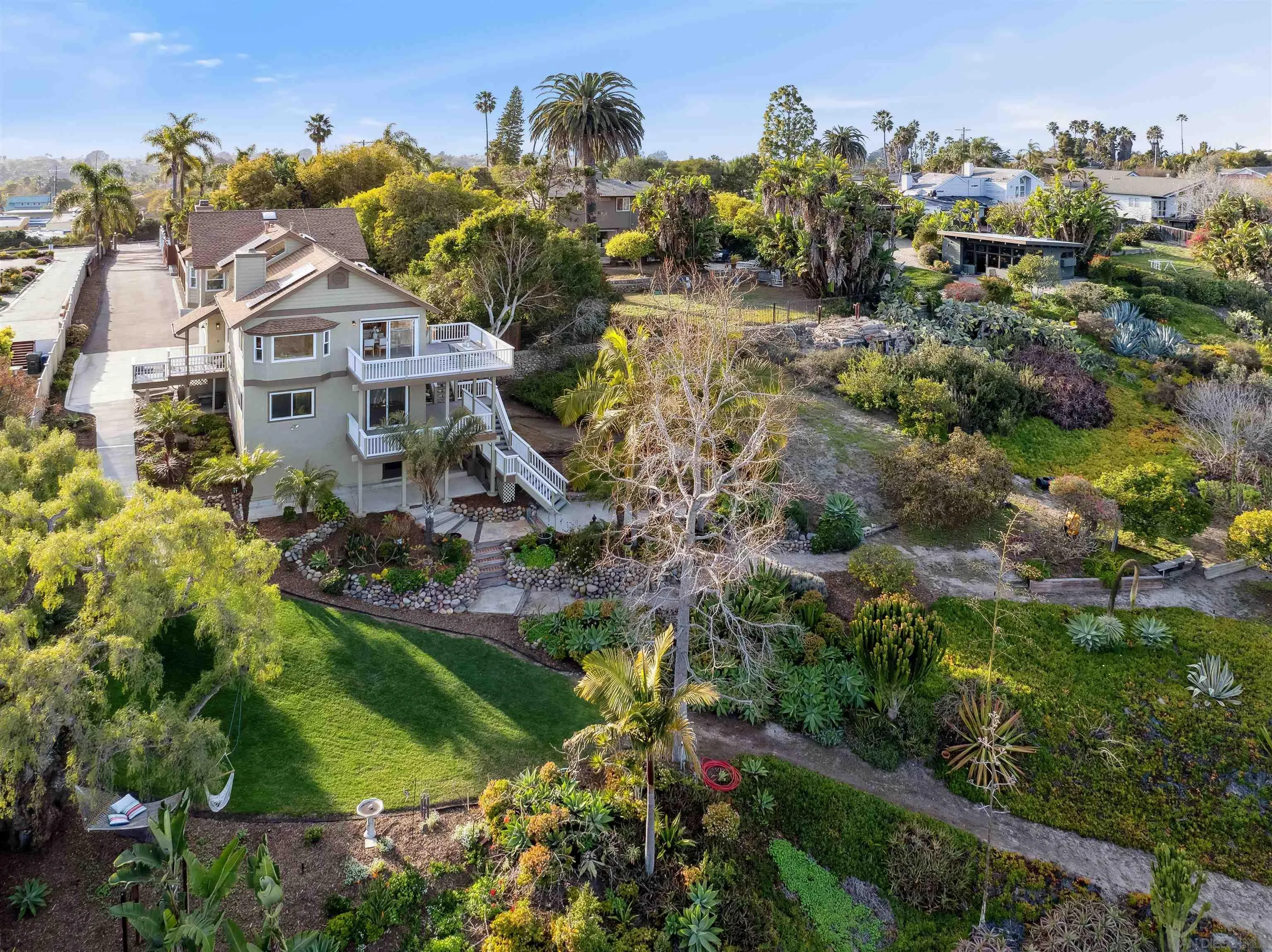 1449 Rainbow Ridge Lane Encinitas, CA 92024 - Photo 1 of 58 an aerial view of residential houses with outdoor space and trees