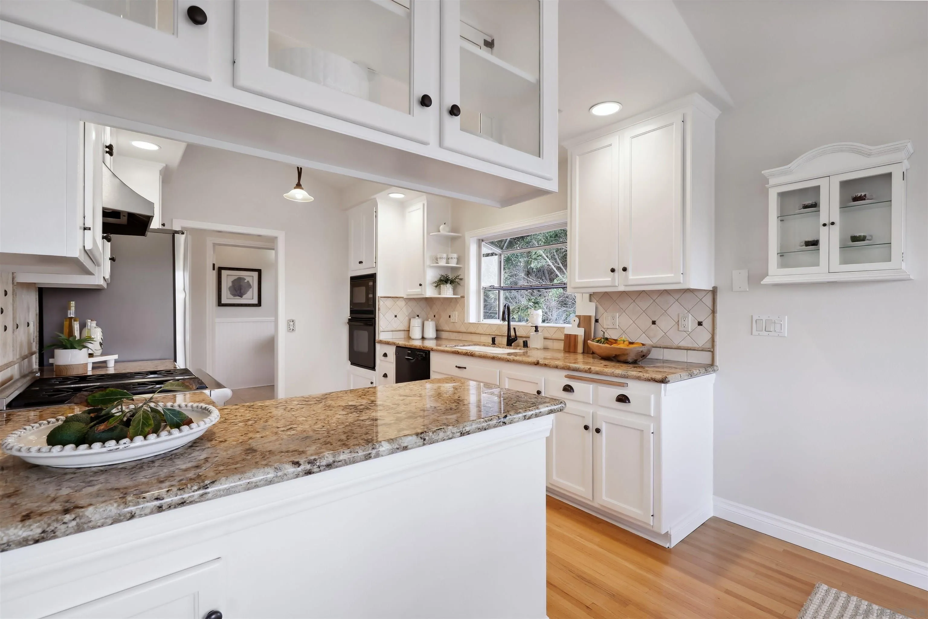 1449 Rainbow Ridge Lane Encinitas, CA 92024 - Photo 12 of 58 a large kitchen with cabinets