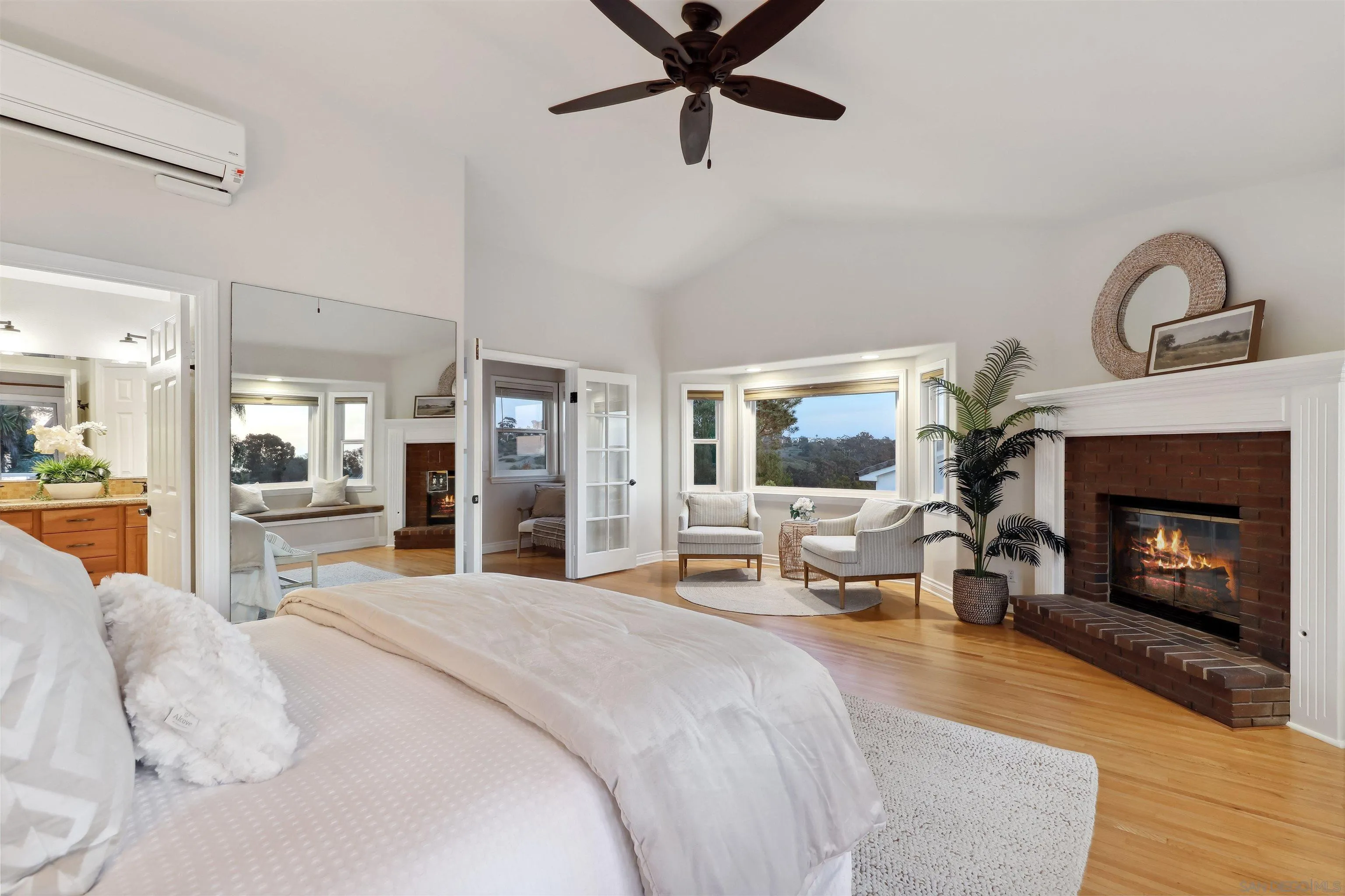 1449 Rainbow Ridge Lane Encinitas, CA 92024 - Photo 18 of 58 a bedroom with a bed and a fireplace