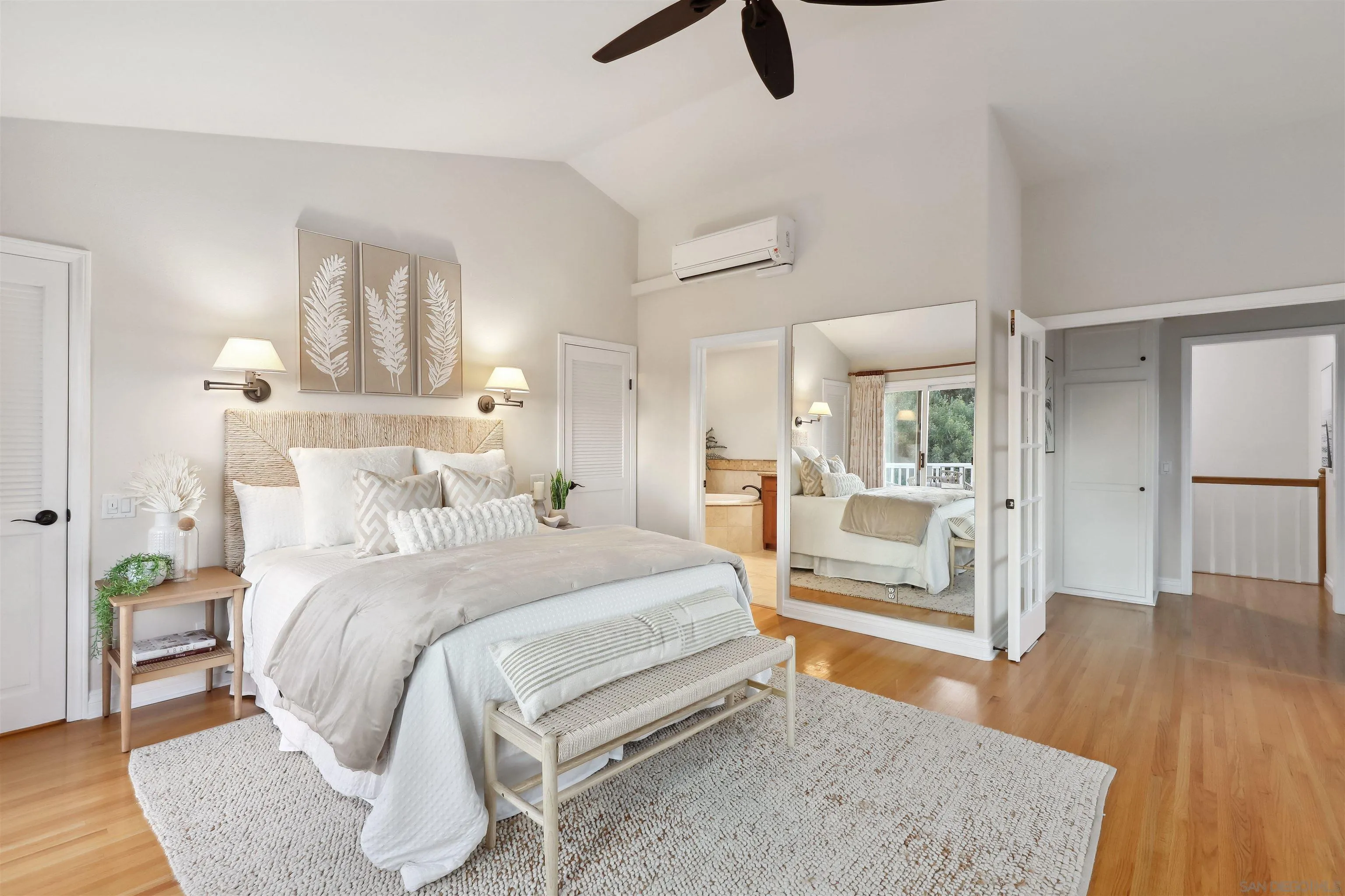 1449 Rainbow Ridge Lane Encinitas, CA 92024 - Photo 19 of 58 a bedroom with a bed and wooden floor