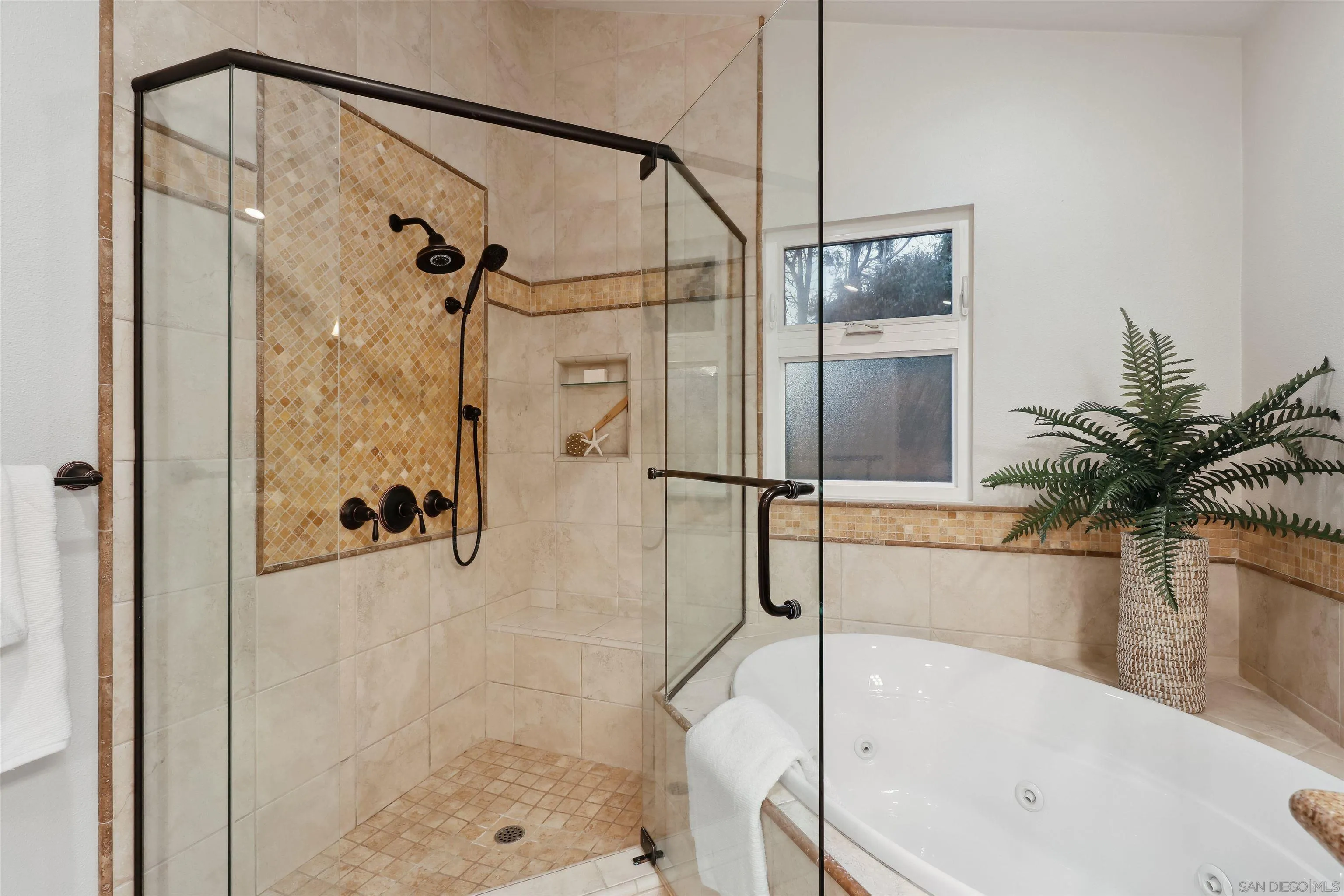 1449 Rainbow Ridge Lane Encinitas, CA 92024 - Photo 20 of 58 a bathroom with a tub shower and view of a bathroom