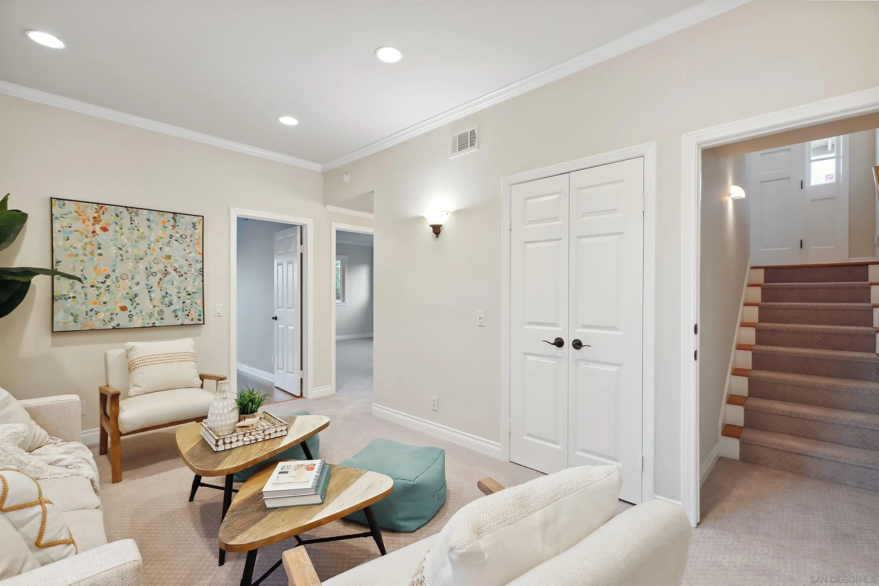 1449 Rainbow Ridge Lane Encinitas, CA 92024 - Photo 23 of 58 a living room with furniture and a painting on the wall