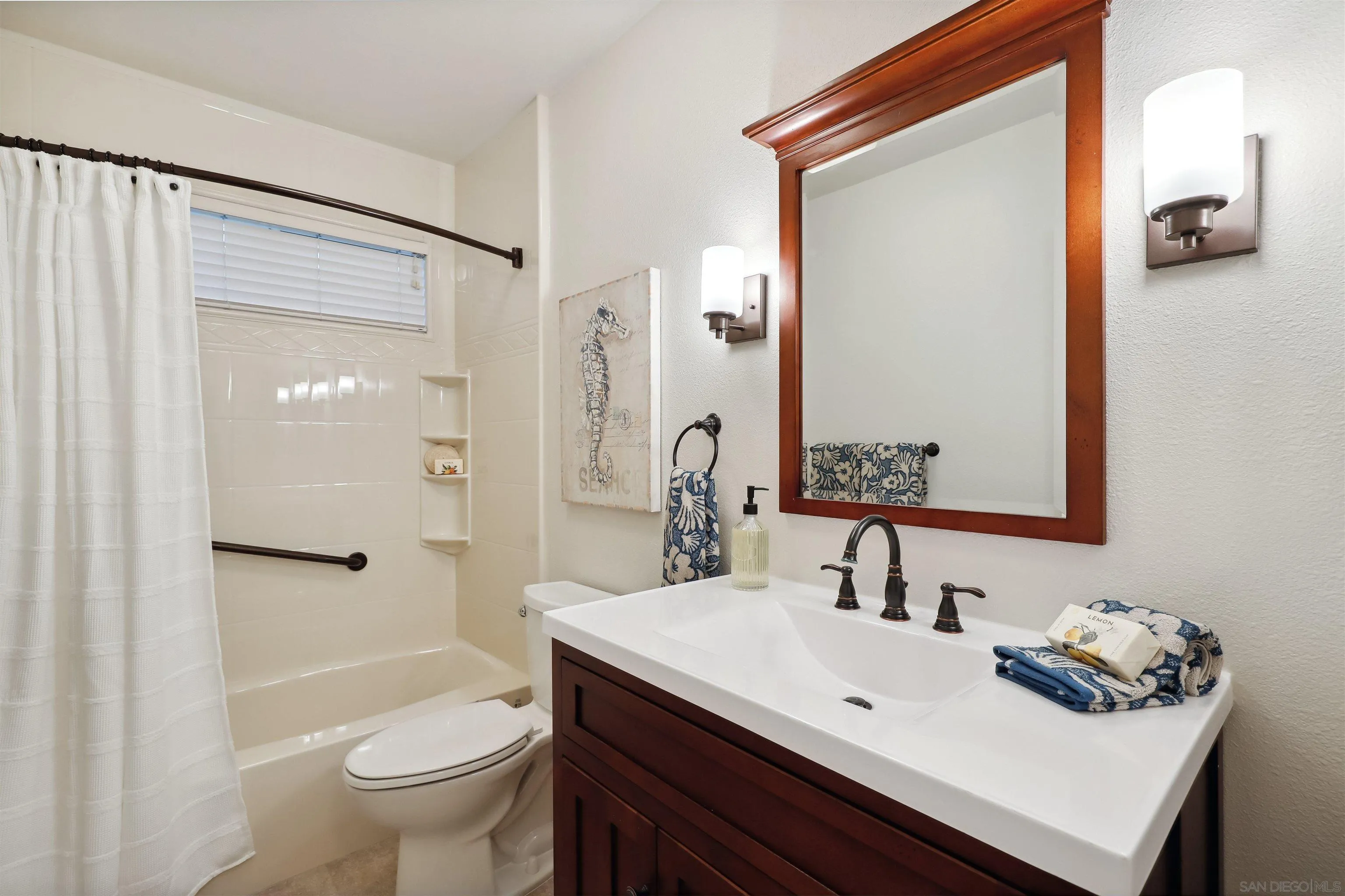 1449 Rainbow Ridge Lane Encinitas, CA 92024 - Photo 28 of 58 a bathroom with a sink toilet and shower