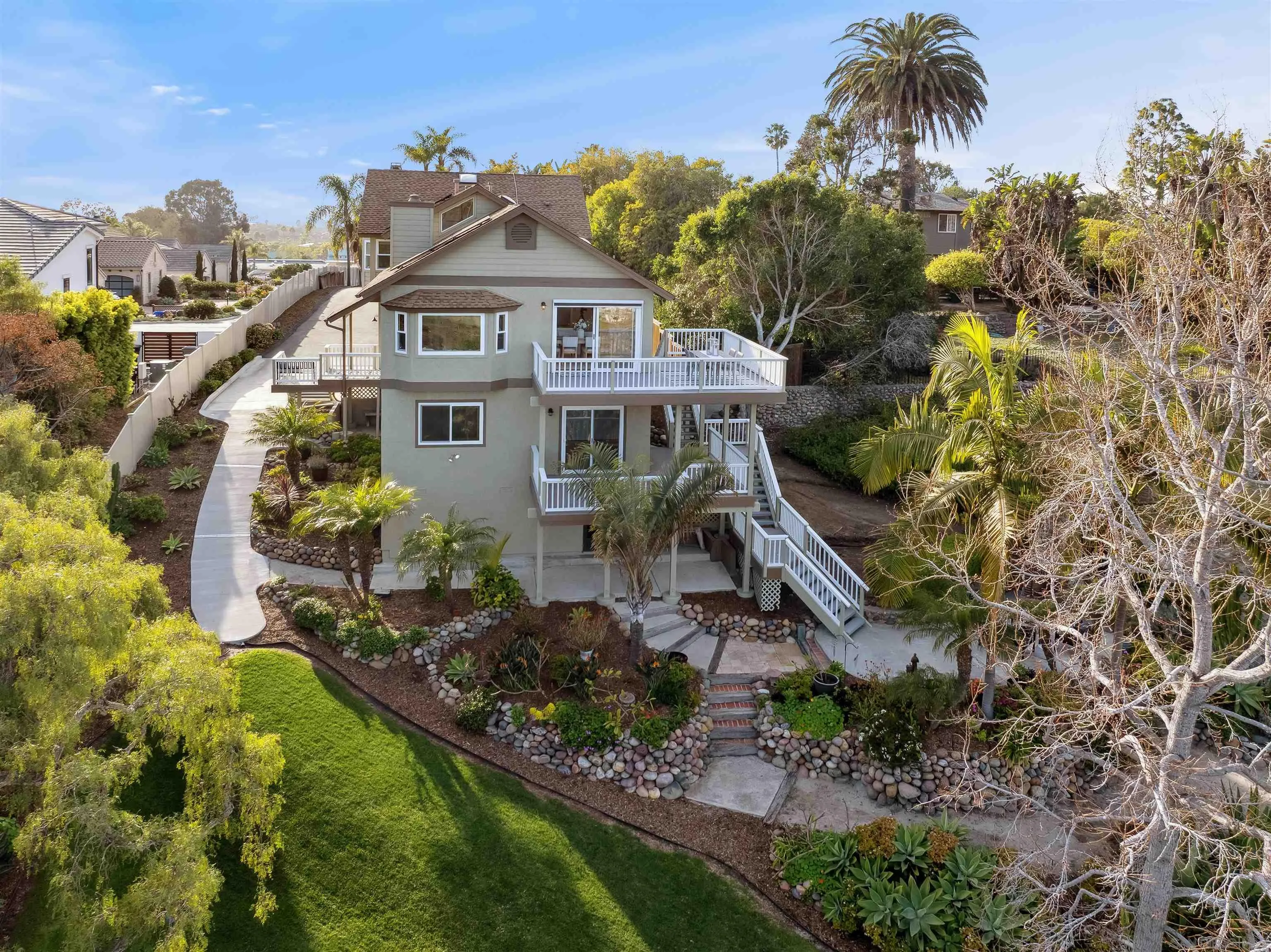 1449 Rainbow Ridge Lane Encinitas, CA 92024 - Photo 3 of 58 a aerial view of a house with a yard and potted plants