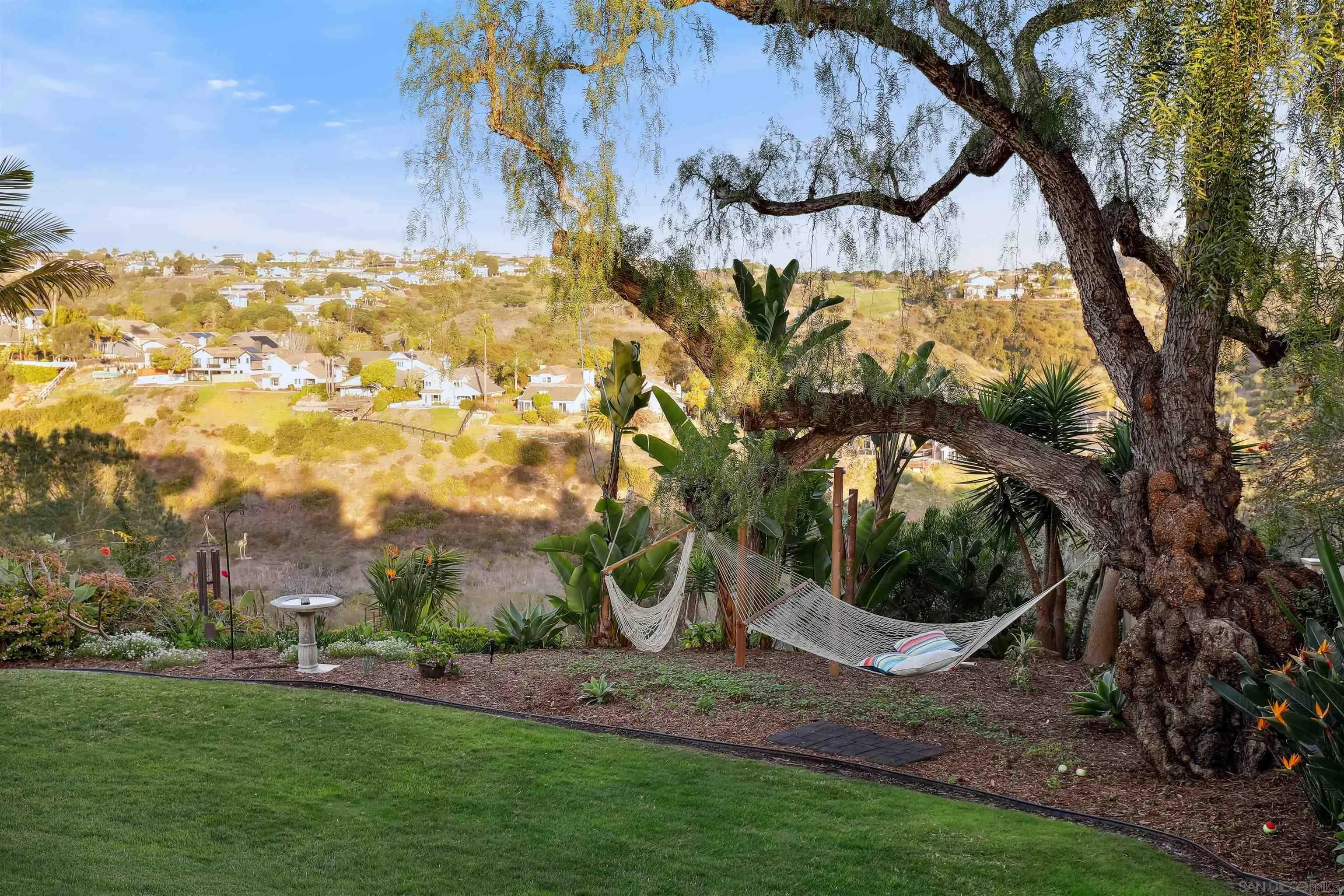 1449 Rainbow Ridge Lane Encinitas, CA 92024 - Photo 34 of 58 a view of a yard with an outdoor space