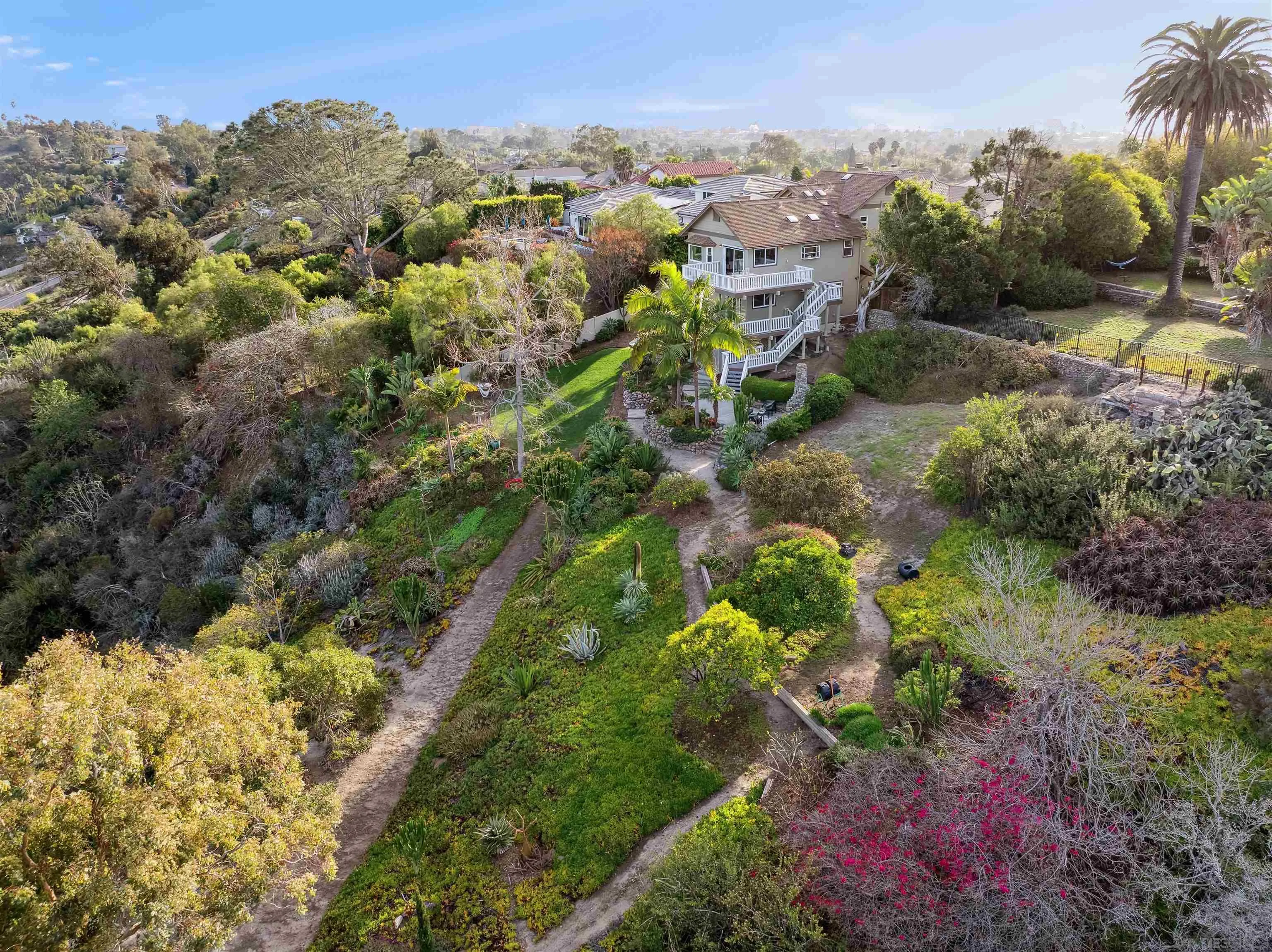 1449 Rainbow Ridge Lane Encinitas, CA 92024 - Photo 40 of 58 a view of a garden with mountains in the background