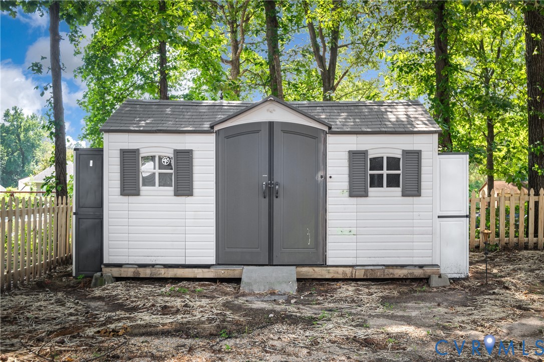 8928 Hawkbill Road North Chesterfield, VA 23237 - Photo 47 of 50 White utility shed featuring dark gray double door