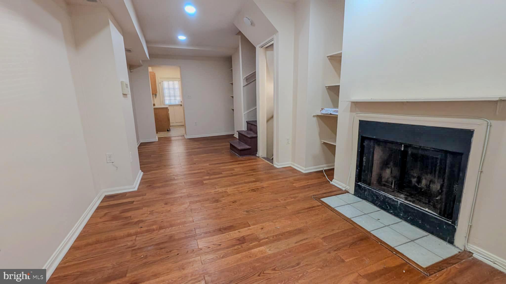209 Penn Street Baltimore, MD 21201 - Photo 2 of 22 a view of a livingroom with a fireplace