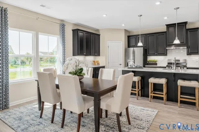 a dining room with furniture and window