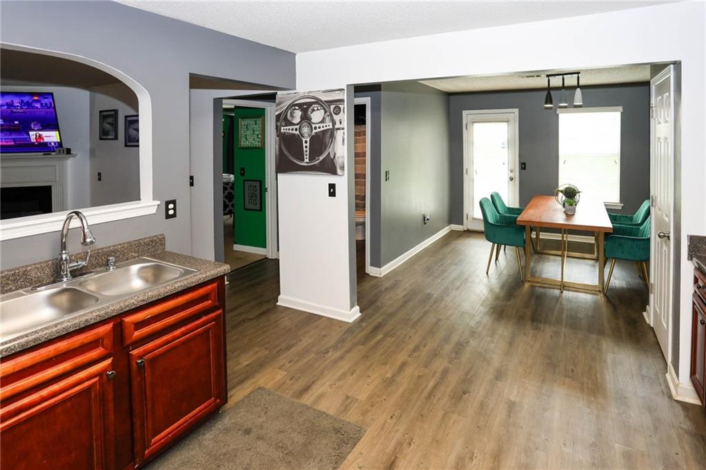 5854 El Segundo Way Atlanta, GA 30349 - Photo 11 of 63 a view of living room with furniture and wooden floor