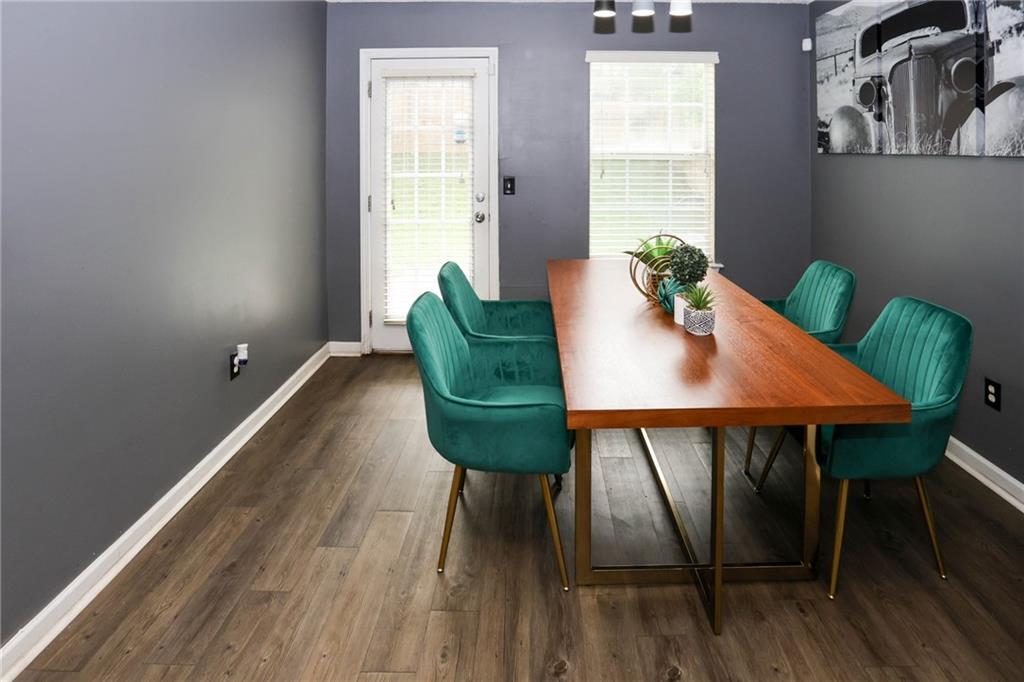 5854 El Segundo Way Atlanta, GA 30349 - Photo 13 of 63 a view of a dining room with furniture window and wooden floor