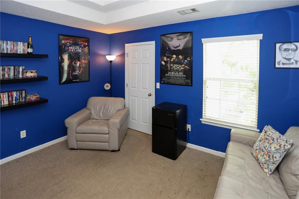5854 El Segundo Way Atlanta, GA 30349 - Photo 16 of 63 a living room with furniture and a window