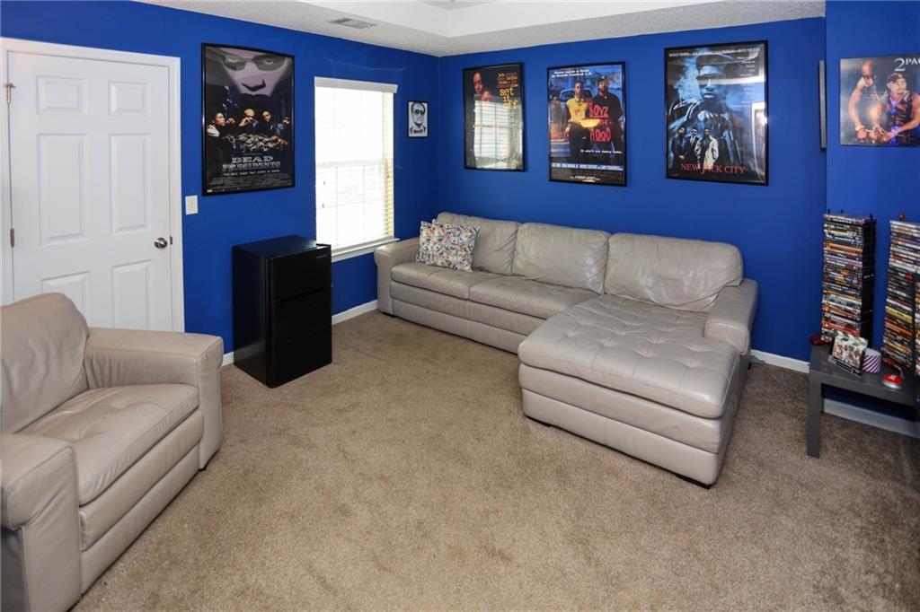 5854 El Segundo Way Atlanta, GA 30349 - Photo 18 of 63 a living room with furniture and a fireplace
