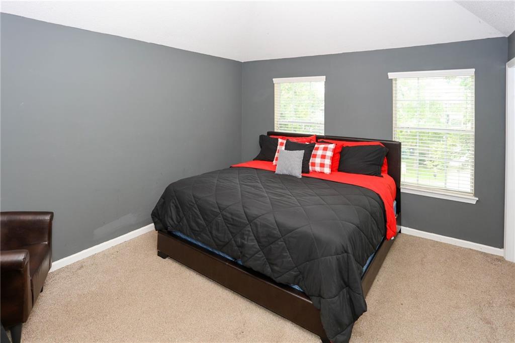 5854 El Segundo Way Atlanta, GA 30349 - Photo 20 of 63 a bedroom with a bed and window