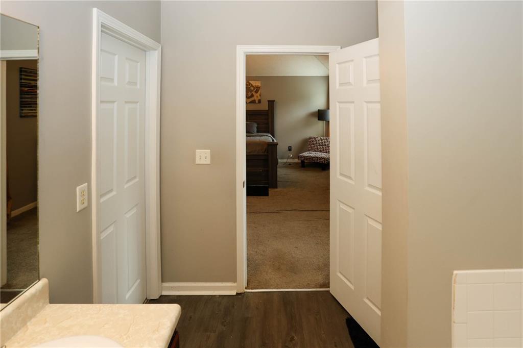 5854 El Segundo Way Atlanta, GA 30349 - Photo 26 of 63 a view of a bedroom from a hallway