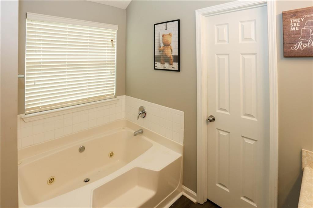 5854 El Segundo Way Atlanta, GA 30349 - Photo 28 of 63 a bathroom with a bathtub