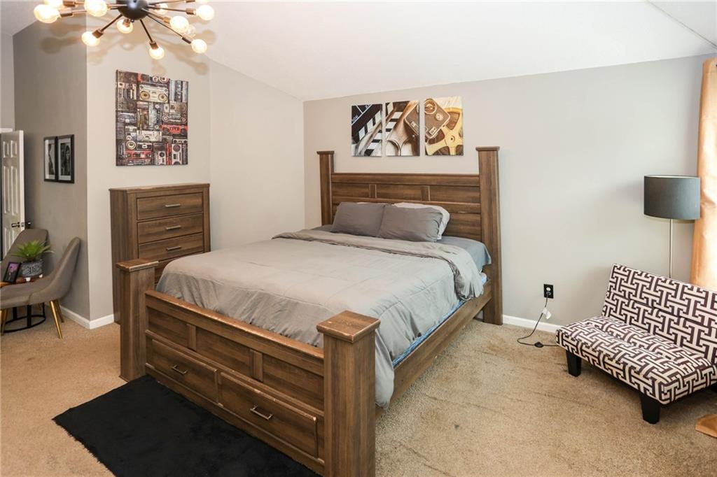 5854 El Segundo Way Atlanta, GA 30349 - Photo 31 of 63 a bedroom with a bed and a couch