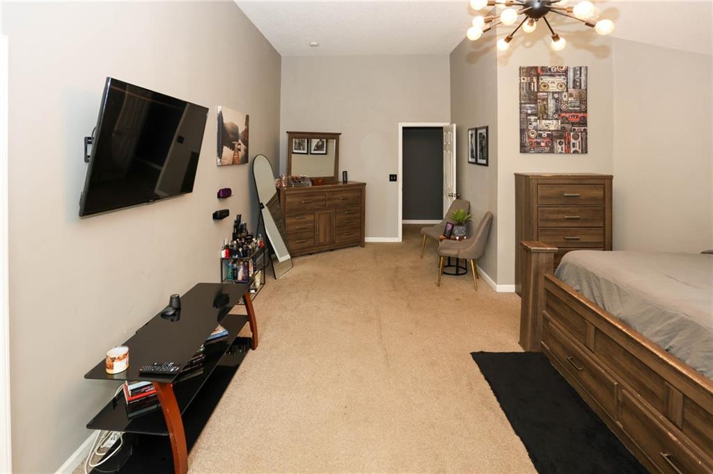 5854 El Segundo Way Atlanta, GA 30349 - Photo 32 of 63 a bedroom with a bed and flat screen tv