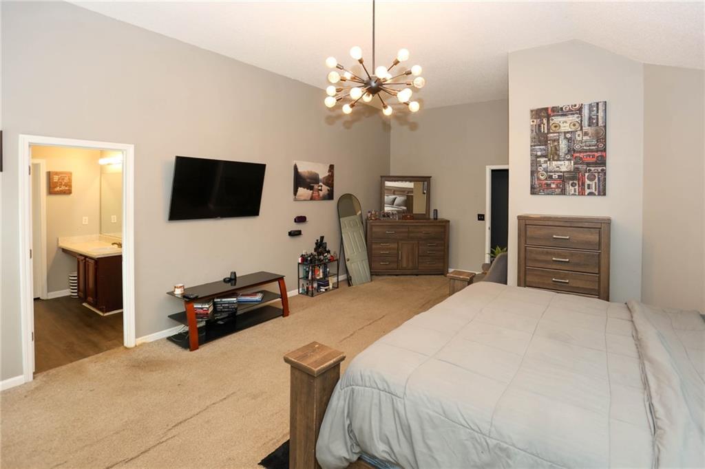 5854 El Segundo Way Atlanta, GA 30349 - Photo 33 of 63 a bedroom with a bed and a flat screen tv