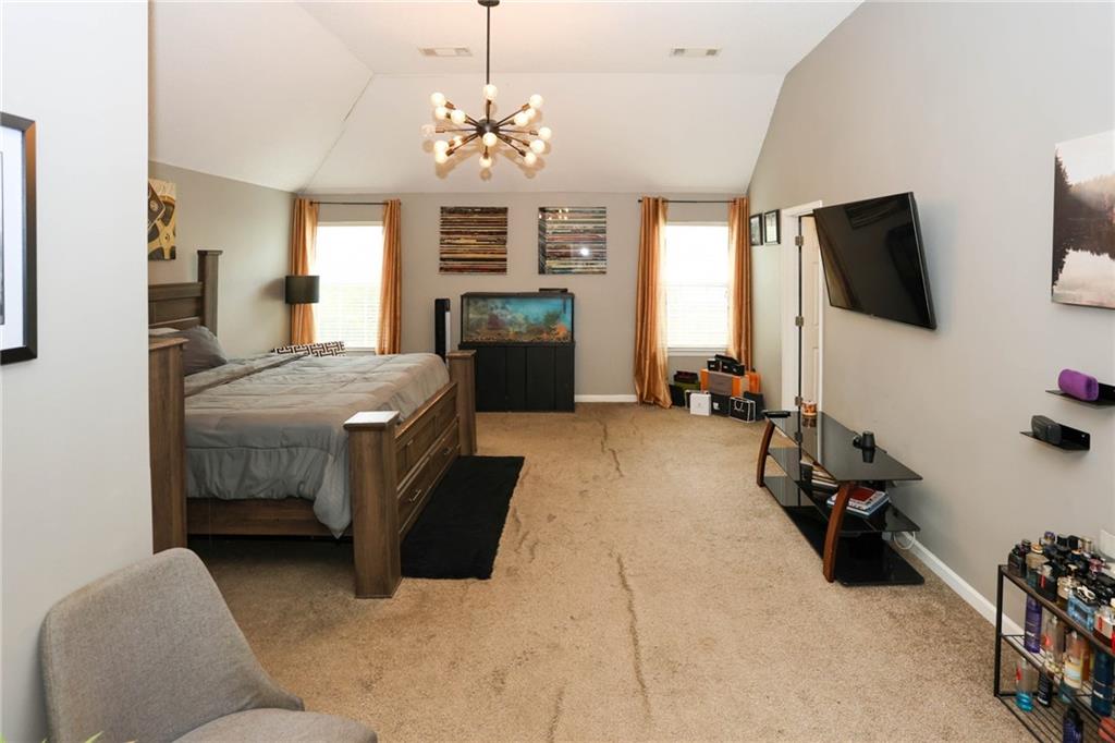 5854 El Segundo Way Atlanta, GA 30349 - Photo 36 of 63 a bedroom with bed tv and window