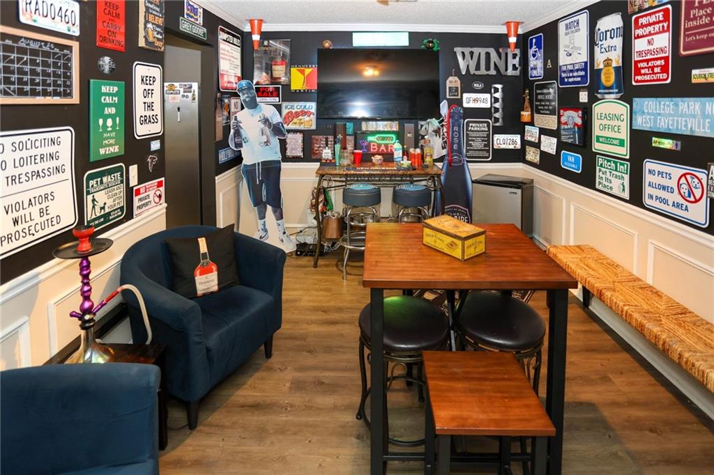 5854 El Segundo Way Atlanta, GA 30349 - Photo 40 of 63 a outdoor living space with furniture and a flat screen tv