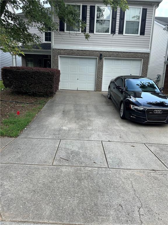 5854 El Segundo Way Atlanta, GA 30349 - Photo 4 of 63 a car parked in front of a house