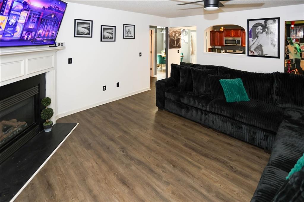 5854 El Segundo Way Atlanta, GA 30349 - Photo 46 of 63 a living room with furniture and a fireplace