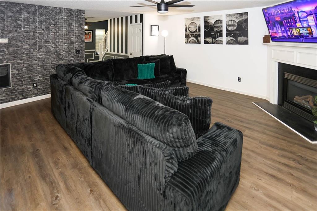 5854 El Segundo Way Atlanta, GA 30349 - Photo 48 of 63 a living room with furniture and a fireplace