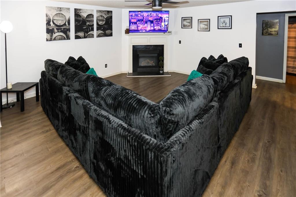 5854 El Segundo Way Atlanta, GA 30349 - Photo 49 of 63 a living room with furniture and a flat screen tv