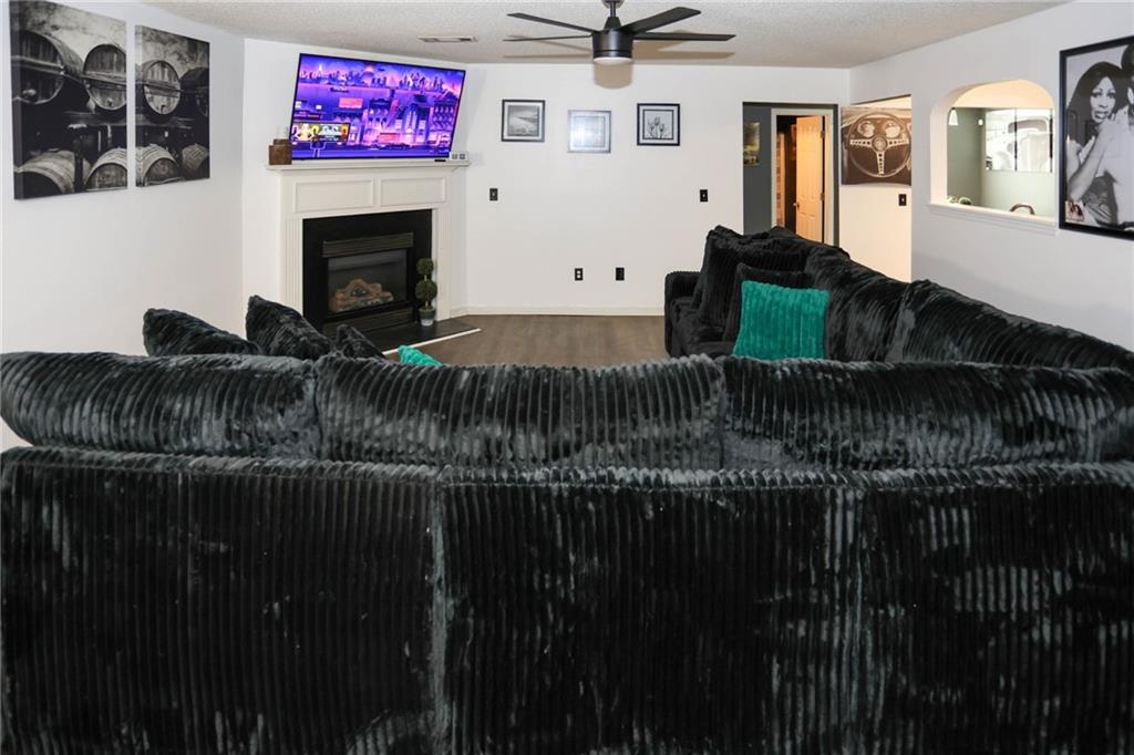 5854 El Segundo Way Atlanta, GA 30349 - Photo 50 of 63 a living room with furniture and a fireplace